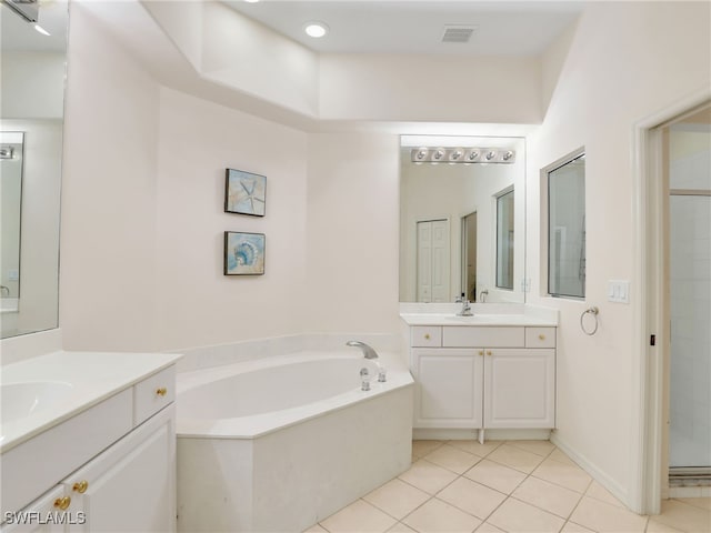 bathroom with vanity, shower with separate bathtub, and tile patterned floors