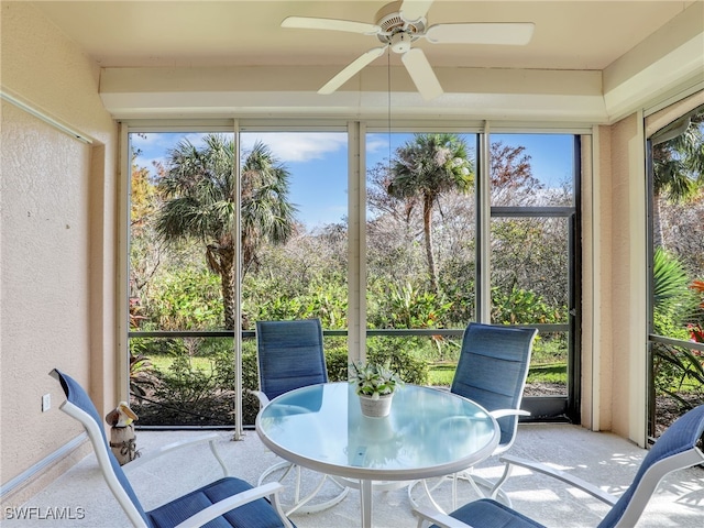 sunroom with plenty of natural light and ceiling fan