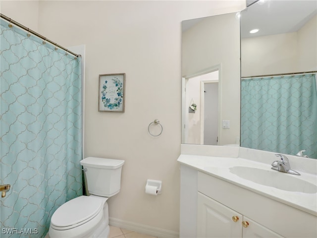 bathroom with vanity, toilet, and tile patterned floors