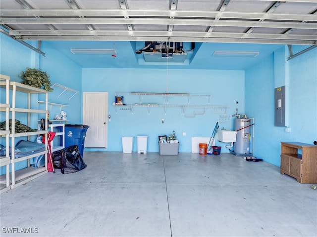 garage with electric water heater and electric panel