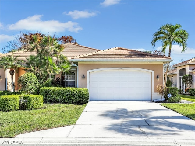 view of front facade with a front lawn and a garage