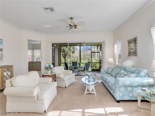 carpeted living room with crown molding and ceiling fan