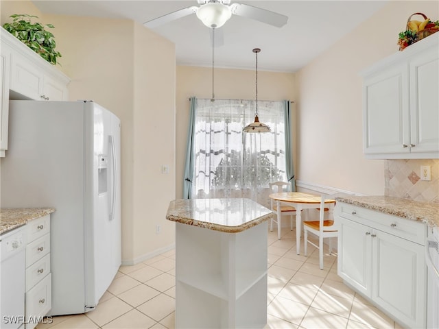 kitchen featuring white cabinetry, light tile patterned floors, and white appliances