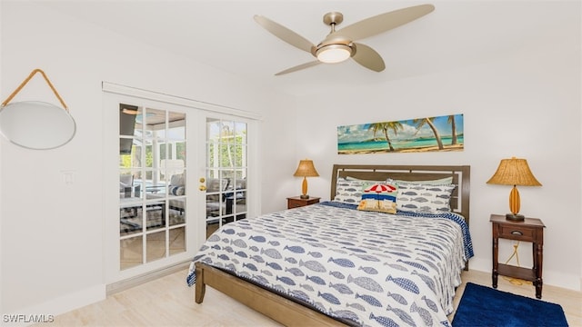 bedroom featuring ceiling fan and french doors