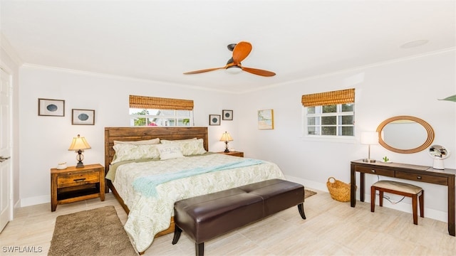 bedroom featuring ceiling fan and crown molding