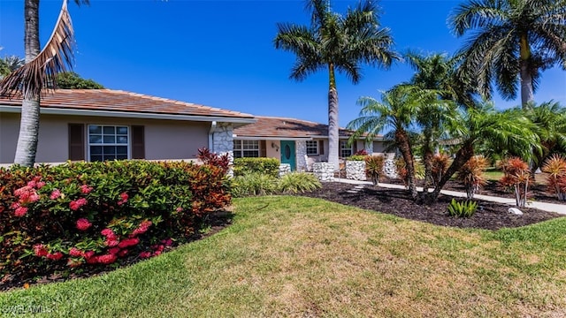 ranch-style home with a front yard