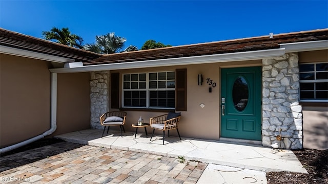 doorway to property featuring a porch