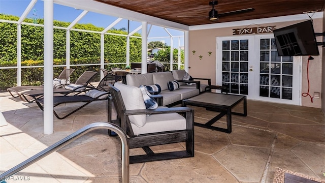 view of patio featuring an outdoor living space, french doors, a lanai, and ceiling fan