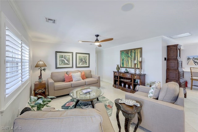 living room featuring crown molding, light tile patterned floors, and ceiling fan