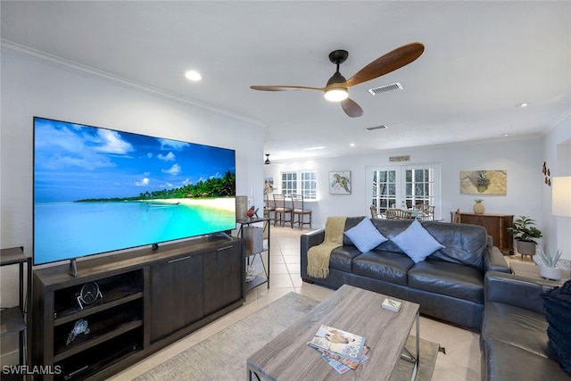 living room featuring light tile patterned floors, ornamental molding, and ceiling fan