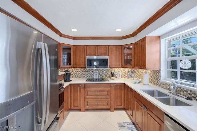 kitchen with tasteful backsplash, sink, ornamental molding, light tile patterned floors, and stainless steel appliances