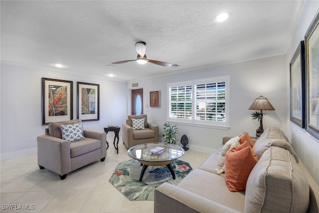 living room with crown molding, light tile patterned flooring, ceiling fan, and a textured ceiling