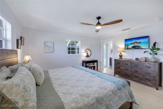 bedroom featuring crown molding and ceiling fan