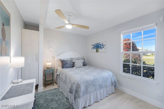 bedroom featuring ceiling fan and light hardwood / wood-style floors