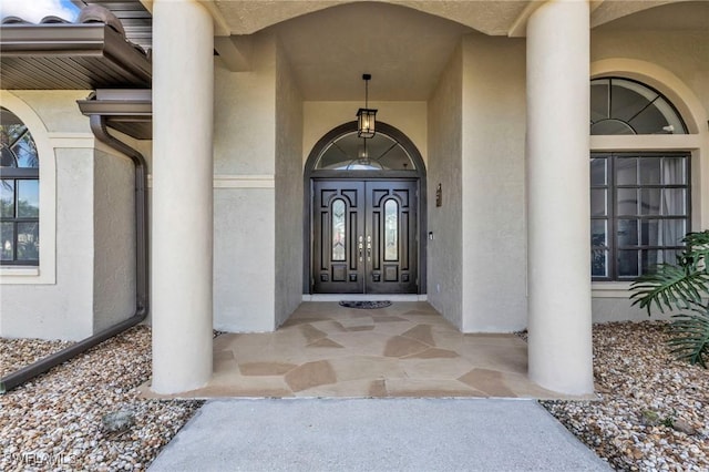 25373 Tether Ln, Punta Gorda, FL 33983 - view of exterior entry featuring stucco siding