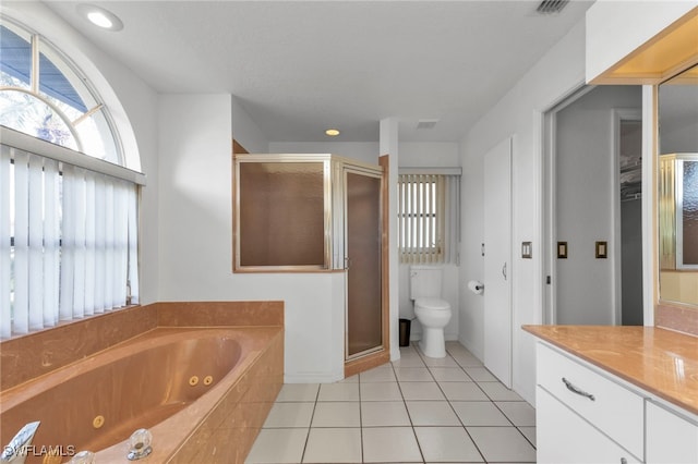 full bathroom with tile patterned flooring, vanity, toilet, and separate shower and tub