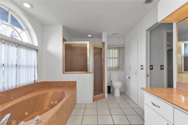 25373 Tether Ln, Punta Gorda, FL 33983 - full bathroom with a shower stall, vanity, a whirlpool tub, tile patterned floors, and toilet