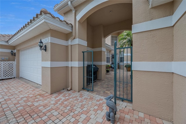 doorway to property featuring a garage