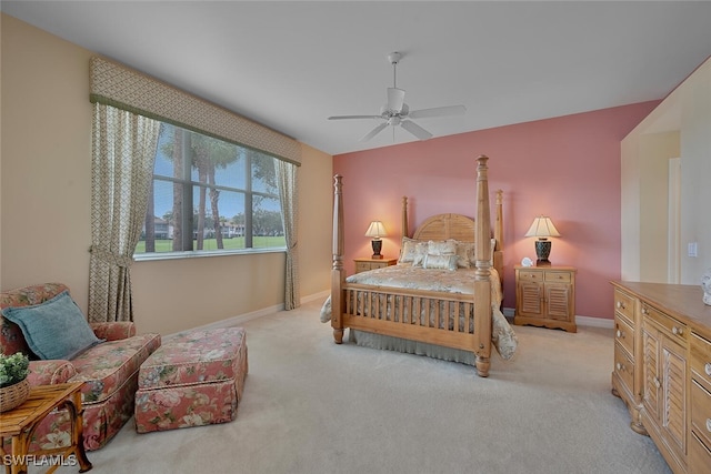 bedroom with ceiling fan and light colored carpet