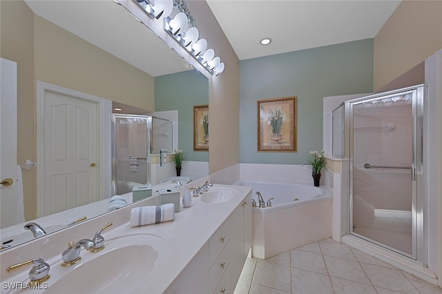 bathroom featuring tile patterned flooring, shower with separate bathtub, and vanity