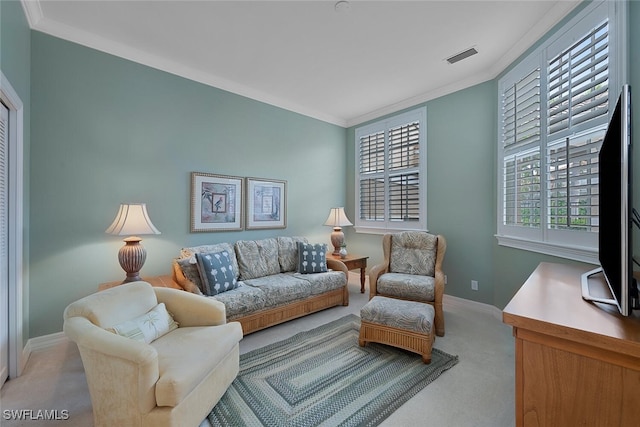 living room with light carpet and ornamental molding