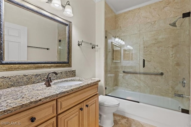 full bathroom featuring bath / shower combo with glass door, tile patterned flooring, ornamental molding, vanity, and toilet