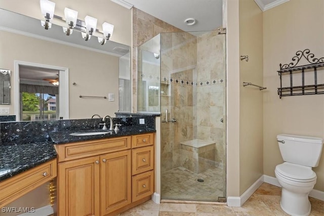 full bathroom with toilet, a stall shower, crown molding, baseboards, and vanity