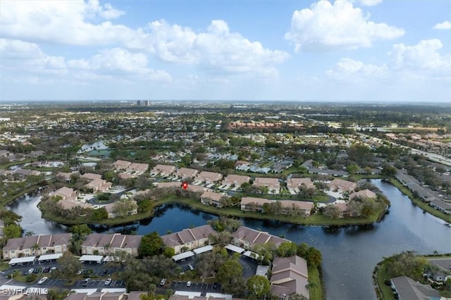 drone / aerial view featuring a residential view and a water view