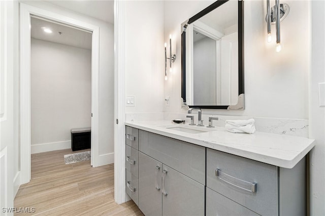 bathroom featuring vanity and hardwood / wood-style floors