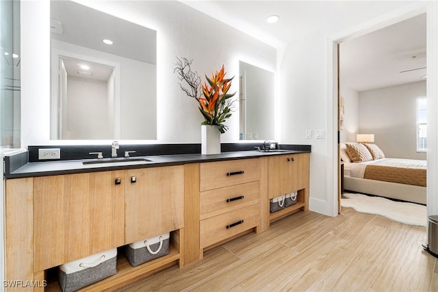 bathroom featuring hardwood / wood-style flooring and vanity