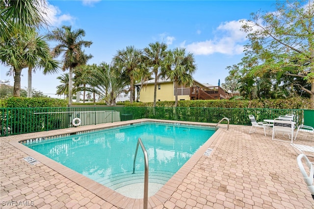 view of pool featuring a patio area