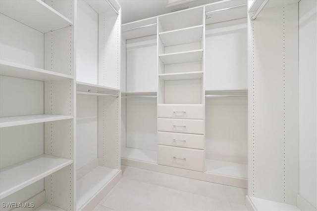 walk in closet featuring light tile patterned floors