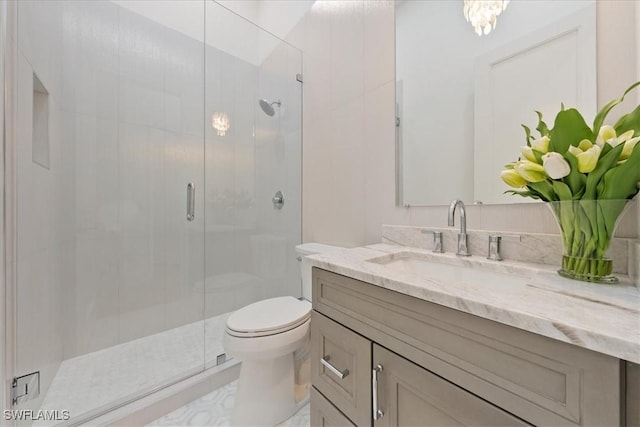 bathroom with vanity, toilet, and walk in shower