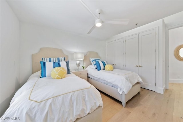 bedroom with ceiling fan and light hardwood / wood-style flooring