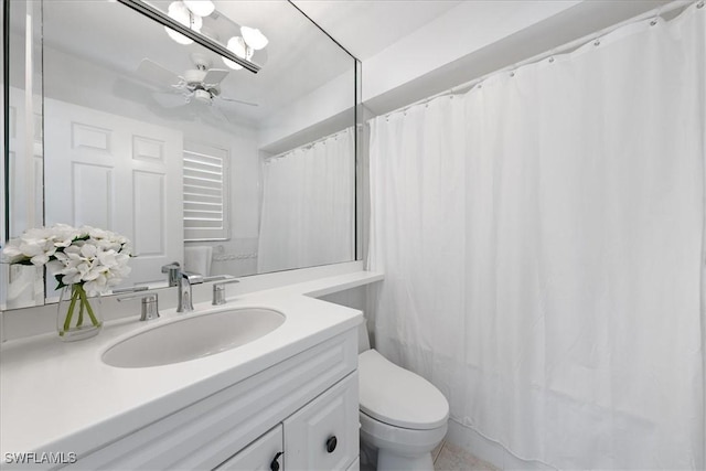 bathroom with ceiling fan, toilet, and vanity