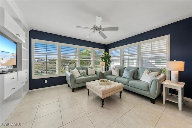 tiled living room featuring ceiling fan and a healthy amount of sunlight