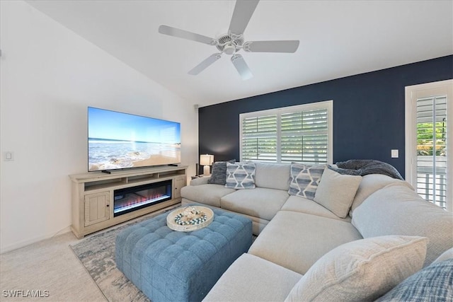 living room featuring light carpet, vaulted ceiling, and ceiling fan