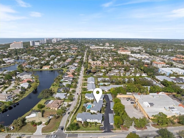 birds eye view of property featuring a water view