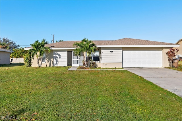 ranch-style home with a front yard and a garage