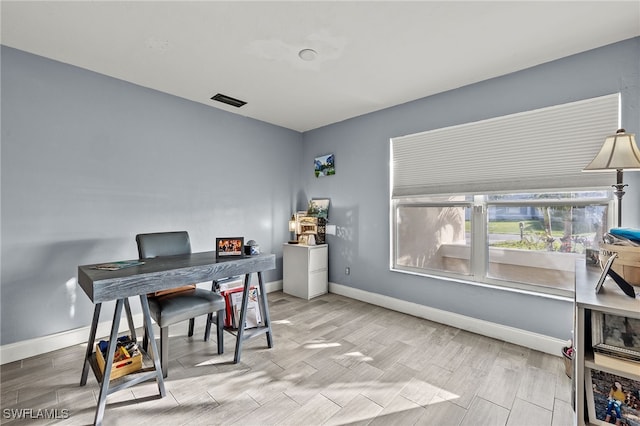 home office with light wood-type flooring