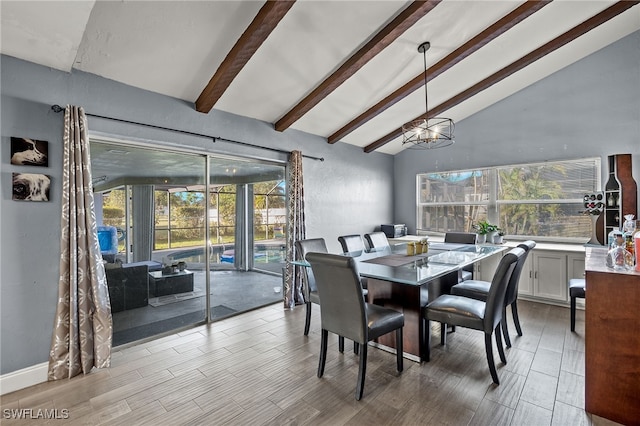 dining room featuring light hardwood / wood-style floors, lofted ceiling with beams, and a wealth of natural light