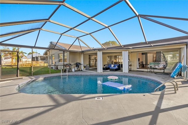 view of pool featuring a patio and a lanai