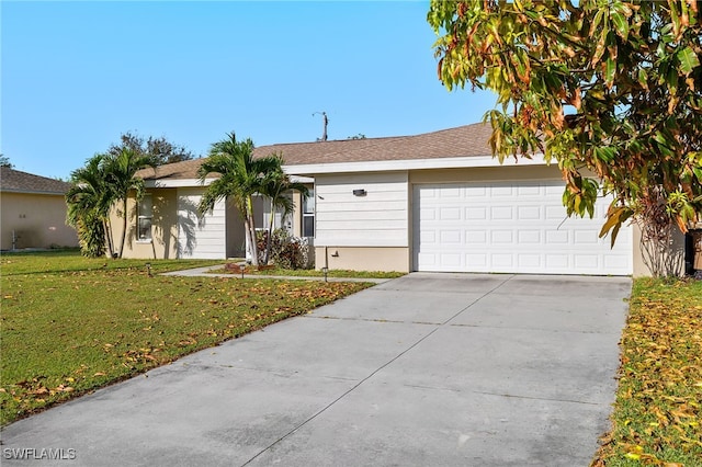 single story home featuring a front yard and a garage