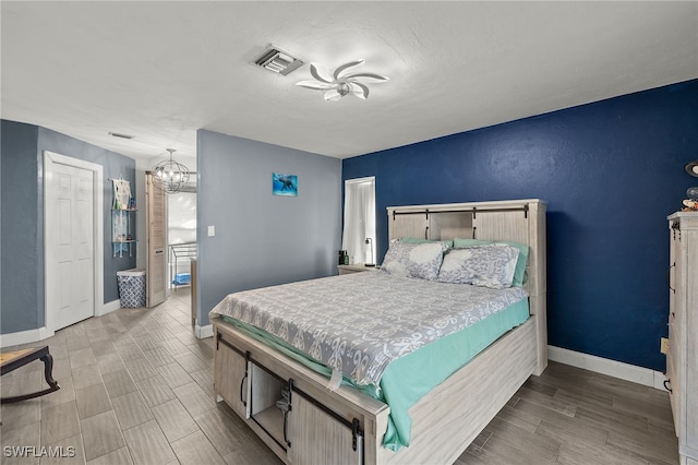 bedroom with hardwood / wood-style flooring