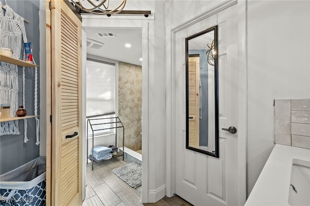 bathroom with wood-type flooring