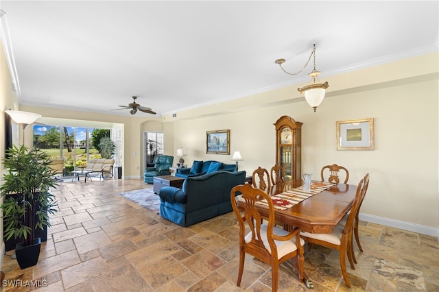 dining area featuring ornamental molding and ceiling fan