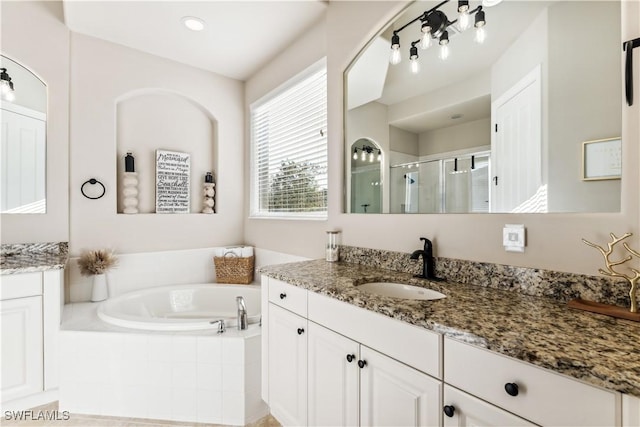 7821 Ashton Rd, Naples, FL 34113 - full bathroom featuring vanity, a shower stall, and a bath
