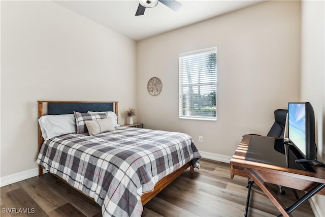 7821 Ashton Rd, Naples, FL 34113 - bedroom with wood finished floors, an office area, and ceiling fan