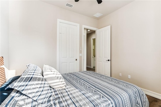 bedroom with ceiling fan and dark hardwood / wood-style floors