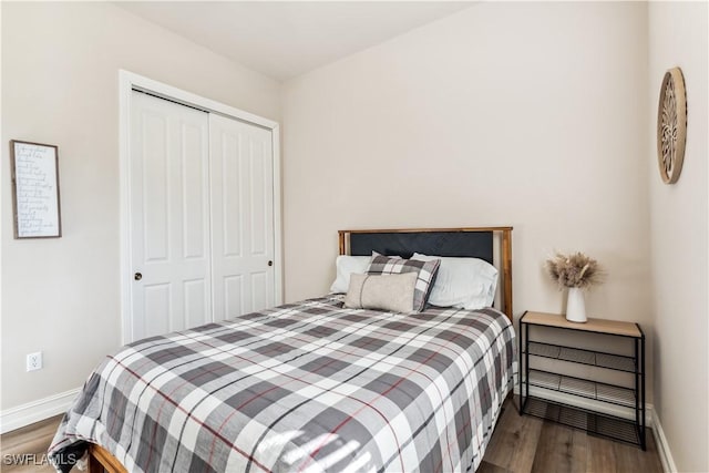 bedroom with a closet and hardwood / wood-style flooring